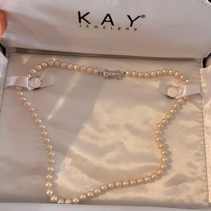 Kay’s pearl necklace with sterling clasp
